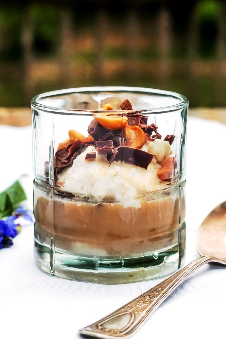 Dessert cup with ice cream, Espresso, shaved chocolate and nuts on a white napkin