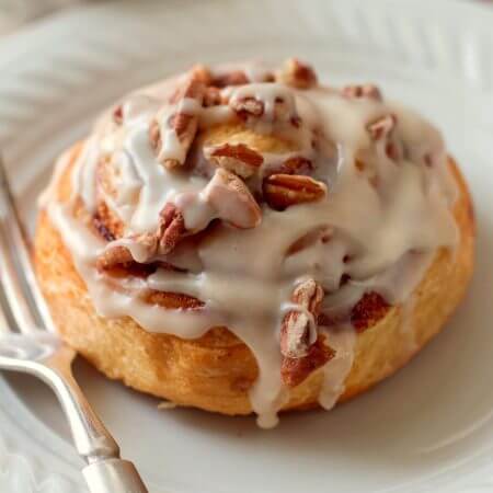 Quick and Easy Browned Butter Frosted Cinnamon Rolls with Pecans