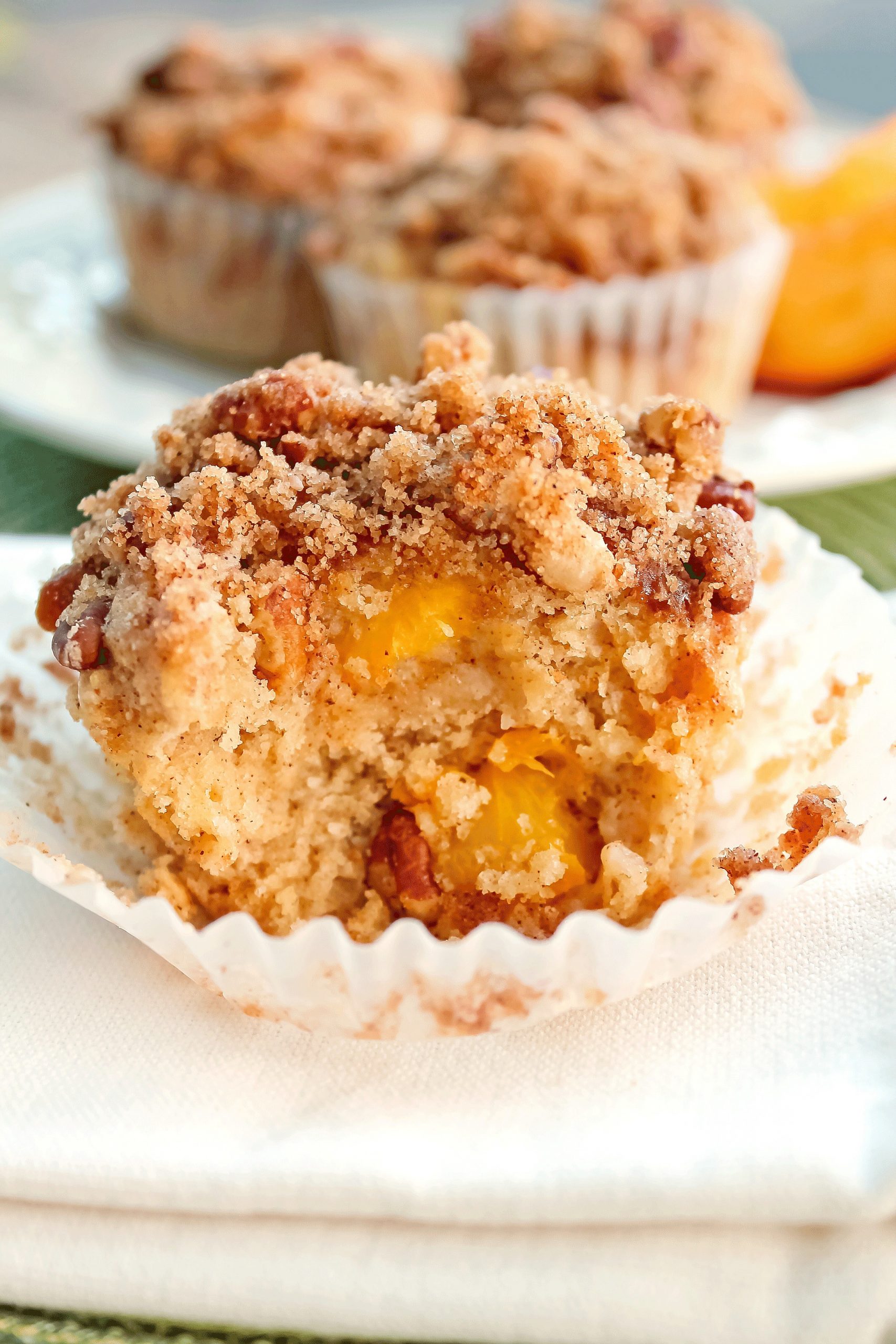 Moist and Delicious Peach Muffins with Crumb Topping