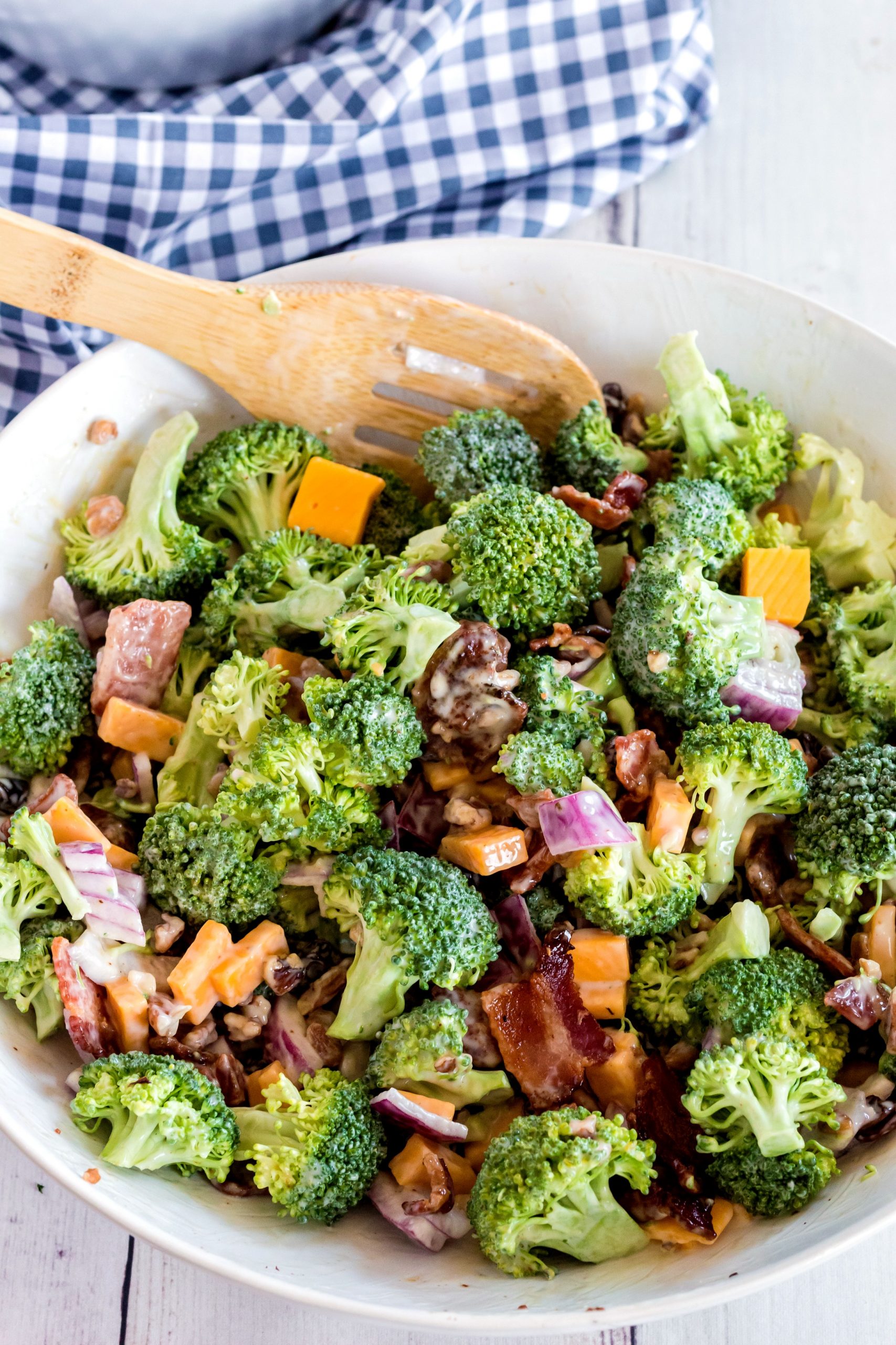 Broccoli with loads of extra toppings tossed into a salad