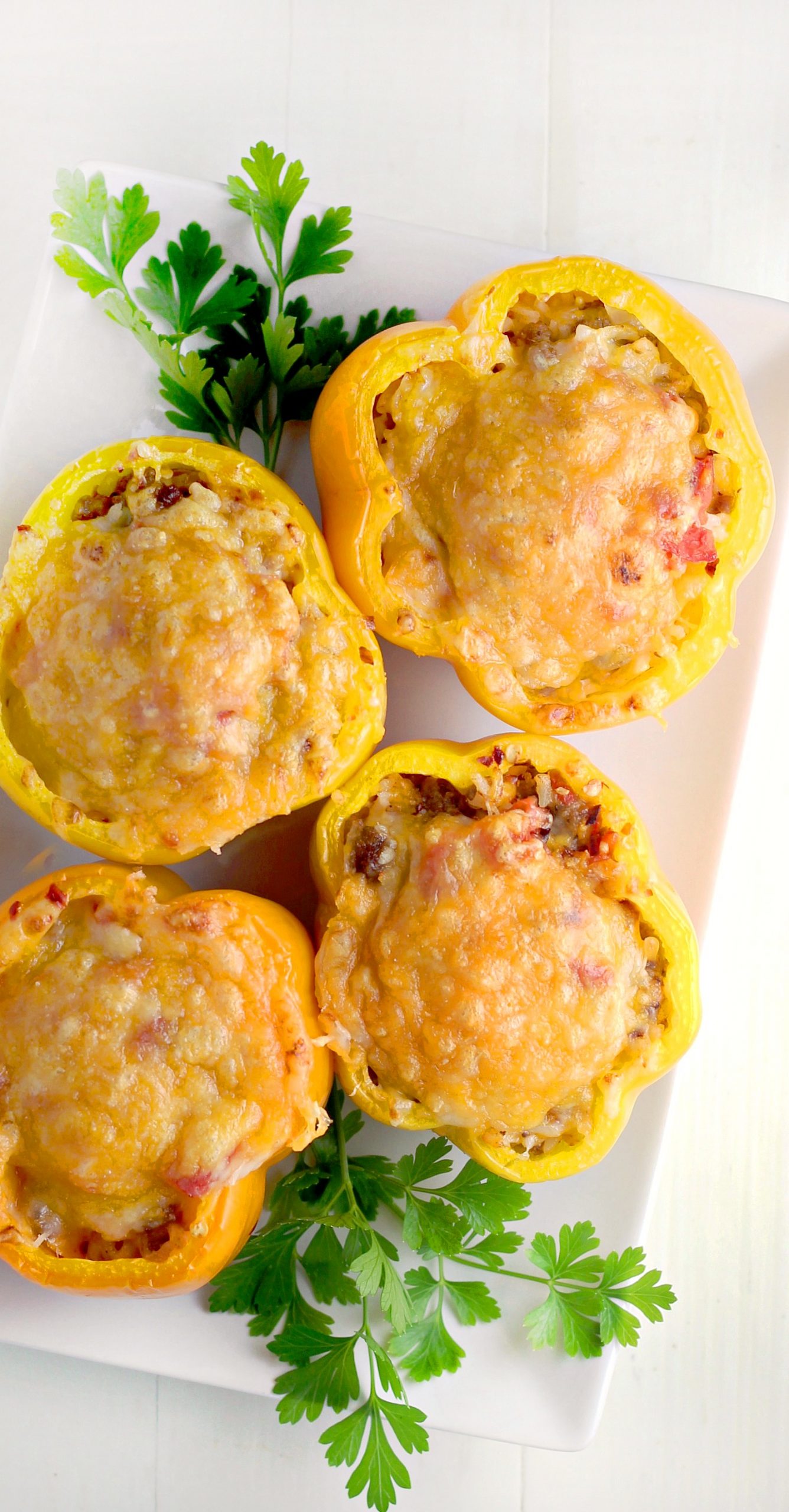 Beautiful yellow peppers stuffed and topped with melted cheeses 